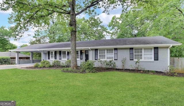 single story home with a carport and a front lawn