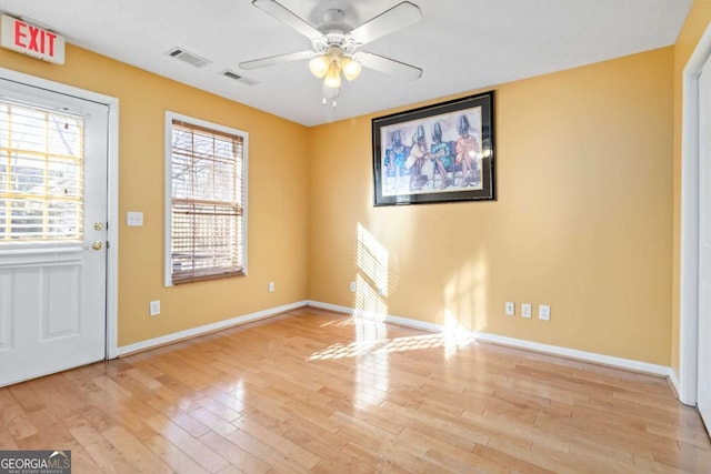 spare room featuring ceiling fan and light wood-type flooring