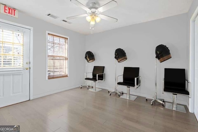 misc room with ceiling fan and hardwood / wood-style floors