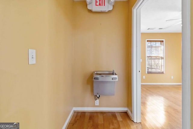 washroom with wood-type flooring