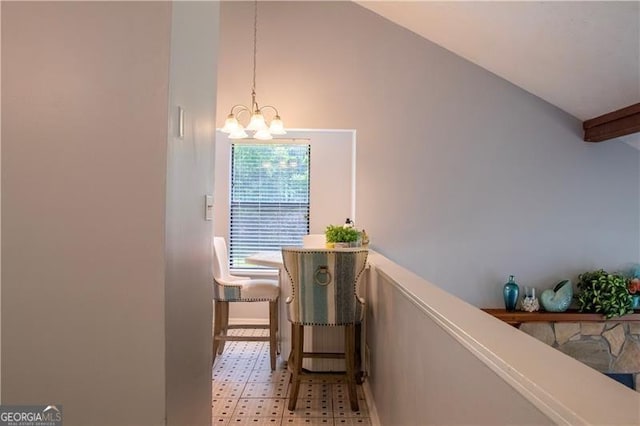 interior space featuring high vaulted ceiling and an inviting chandelier