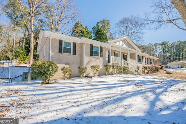 ranch-style home featuring covered porch