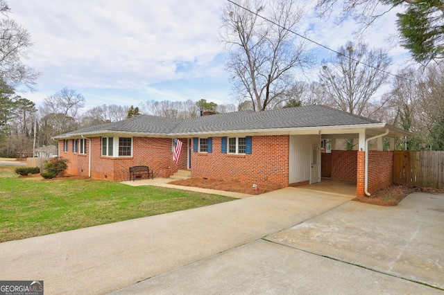 ranch-style house featuring a carport and a front yard