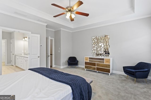 carpeted bedroom with connected bathroom, crown molding, a raised ceiling, and ceiling fan