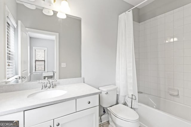 full bathroom with vanity, toilet, and shower / bath combo with shower curtain