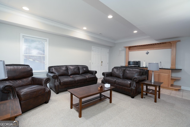 living room featuring light carpet and crown molding