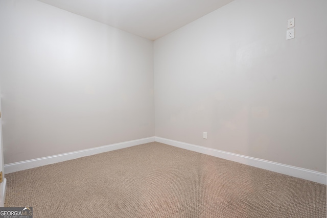 unfurnished room featuring carpet