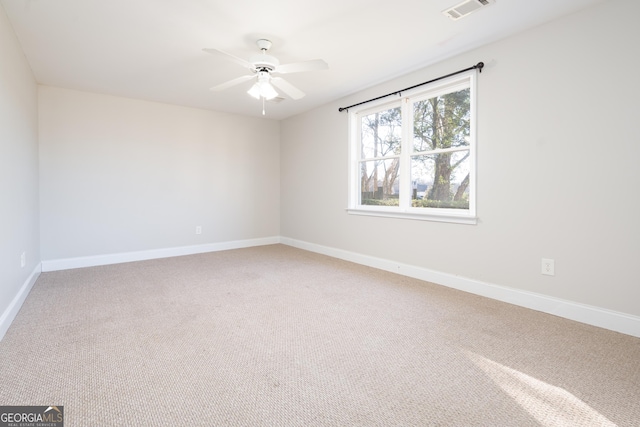 spare room with ceiling fan and carpet floors