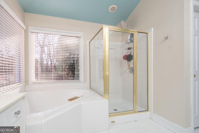 bathroom with tile patterned floors, lofted ceiling, independent shower and bath, and vanity