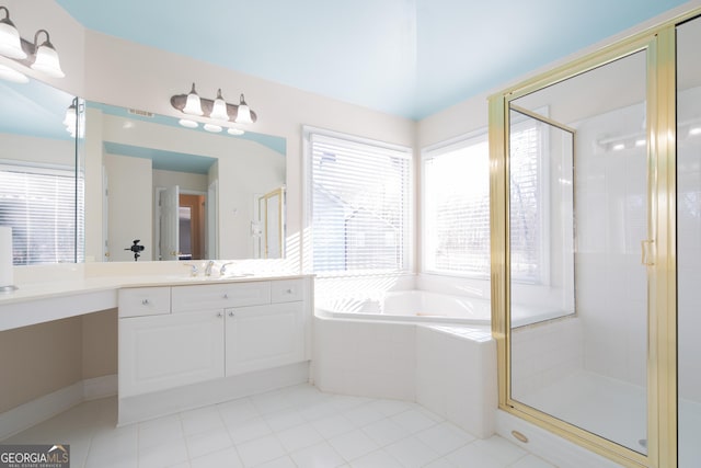 bathroom featuring vanity, independent shower and bath, and tile patterned floors