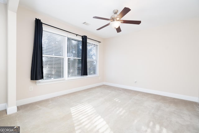 carpeted empty room with ceiling fan