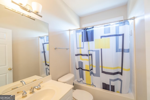 full bathroom featuring vanity, shower / tub combo with curtain, and toilet