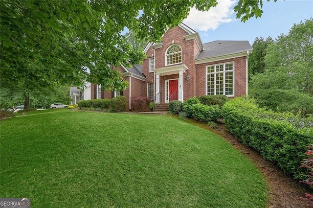 view of property featuring a front yard