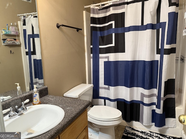 bathroom with vanity, a shower with curtain, and toilet