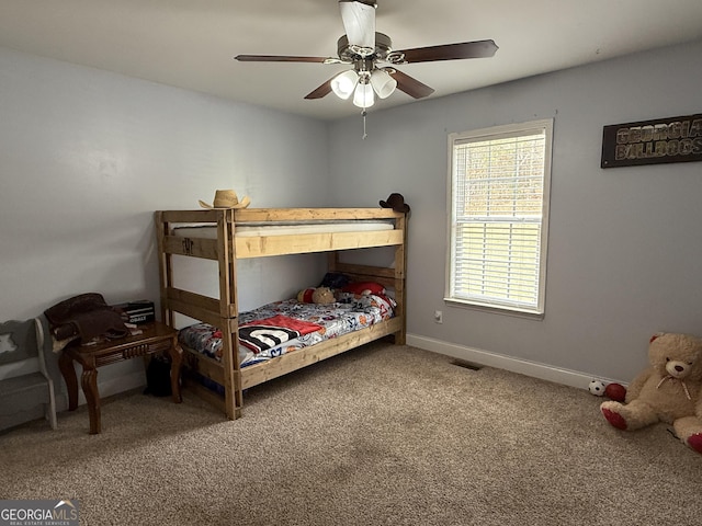 carpeted bedroom featuring ceiling fan