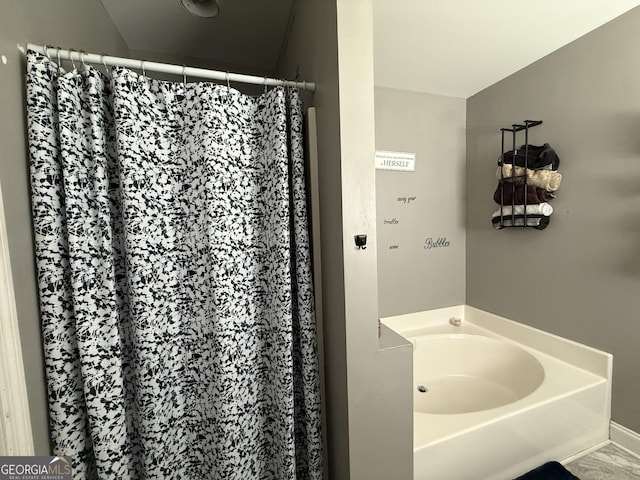 bathroom featuring a tub to relax in