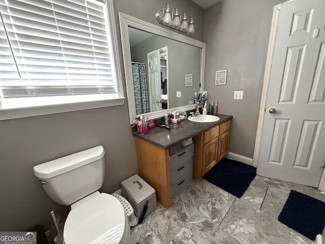 bathroom featuring vanity and toilet