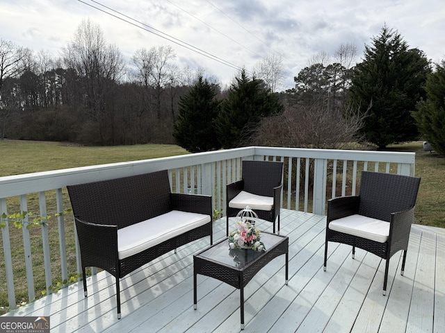 wooden deck featuring a yard and an outdoor hangout area