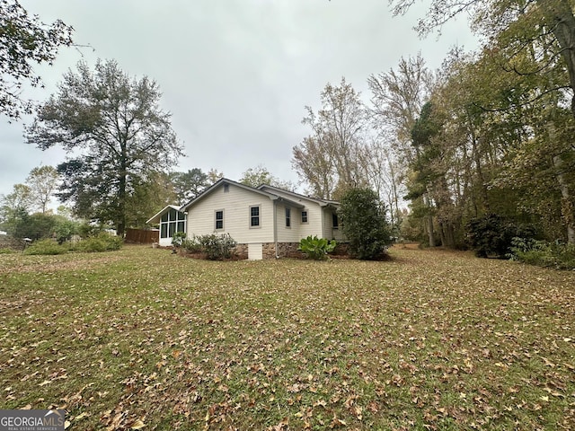 view of home's exterior featuring a yard