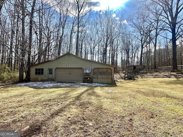 garage with a lawn