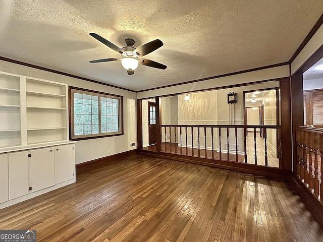 unfurnished room featuring ornamental molding, hardwood / wood-style floors, ceiling fan, and a textured ceiling