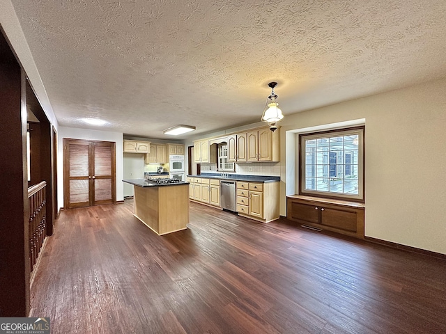 kitchen with light brown cabinets, stainless steel dishwasher, dark hardwood / wood-style floors, a kitchen island, and pendant lighting