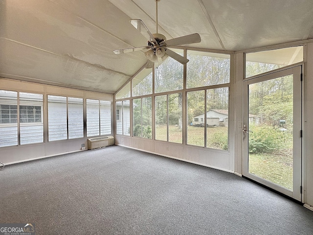 unfurnished sunroom featuring ceiling fan and vaulted ceiling