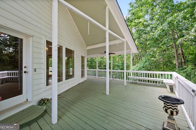 wooden terrace featuring ceiling fan