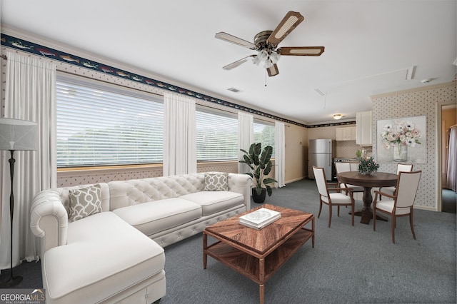 carpeted living room featuring ceiling fan