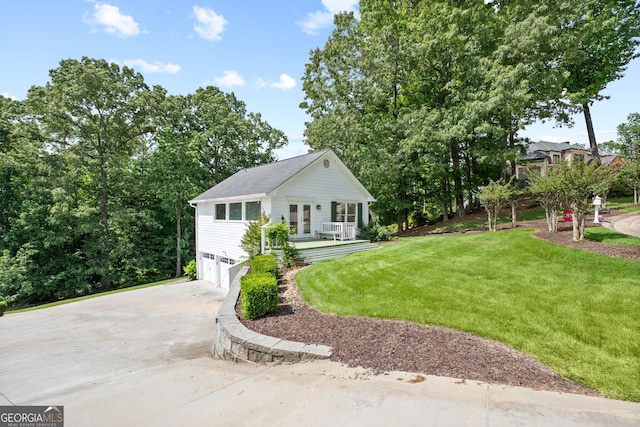 view of front of home with a garage and a front yard