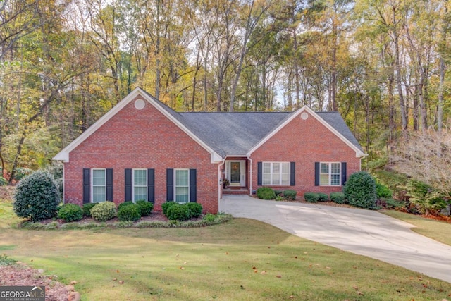 single story home featuring a front yard