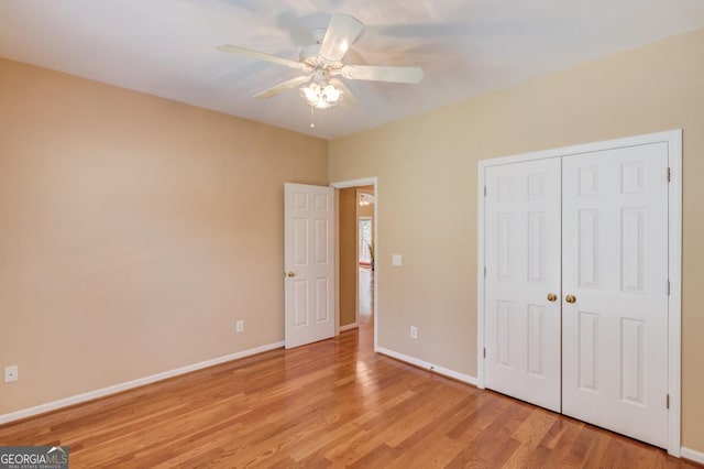 unfurnished bedroom featuring a closet, ceiling fan, and light hardwood / wood-style flooring