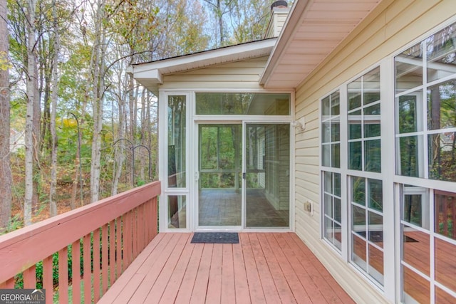 wooden terrace featuring a sunroom