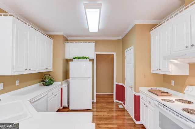 kitchen with sink, white cabinets, white appliances, and light hardwood / wood-style floors