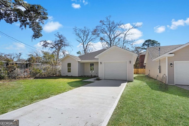 view of front of house with a garage and a front lawn