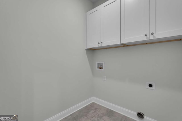 washroom featuring cabinets, washer hookup, and hookup for an electric dryer