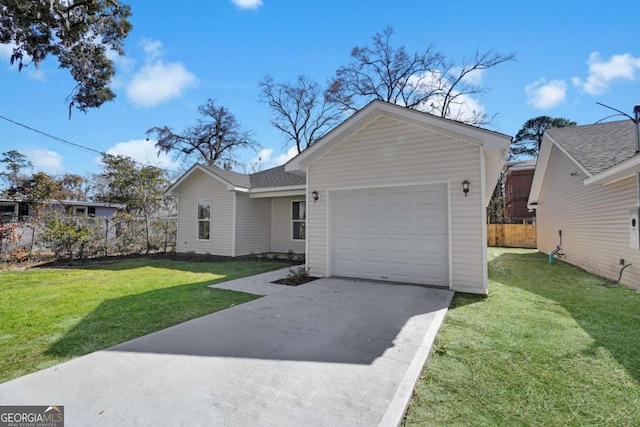 single story home featuring a garage and a front lawn