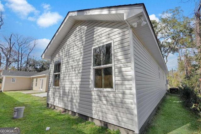 view of home's exterior featuring a yard and a patio