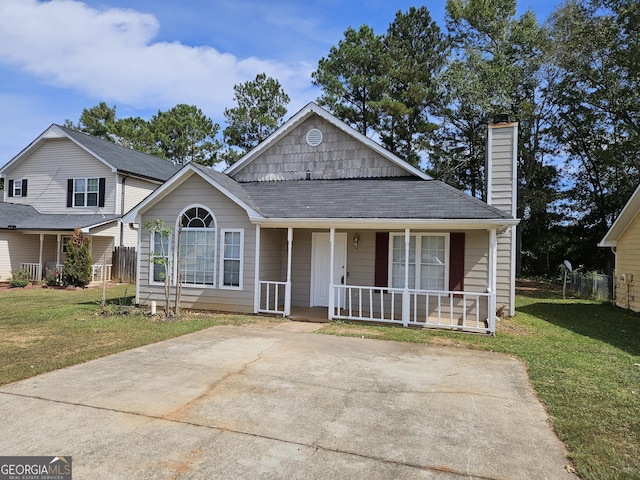 view of front of house featuring a front yard and covered porch