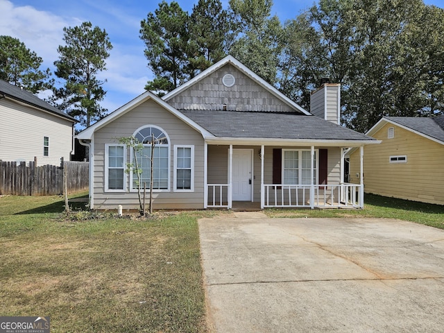 view of front facade with a front lawn and a porch