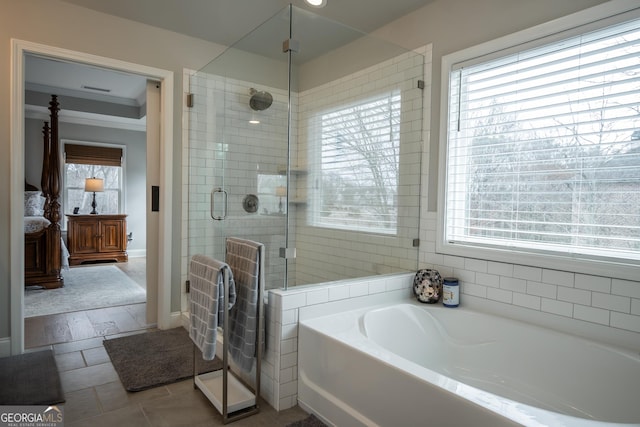 bathroom with crown molding, plus walk in shower, and tile patterned flooring