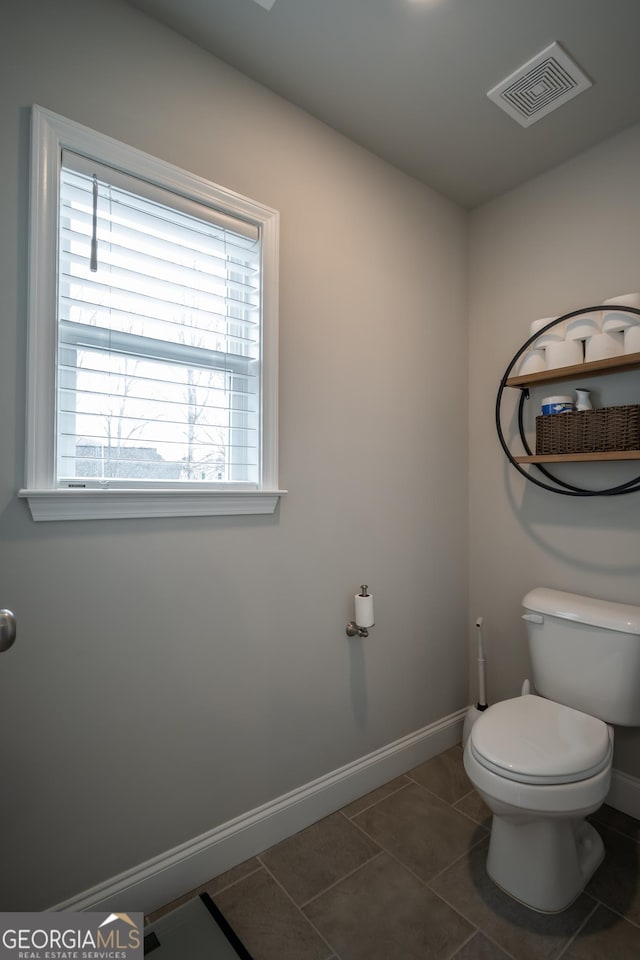 bathroom featuring tile patterned floors and toilet