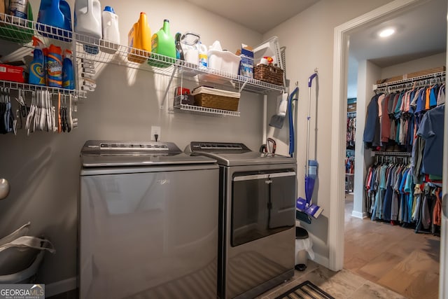 washroom with independent washer and dryer