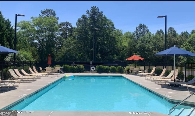 view of swimming pool featuring a patio area