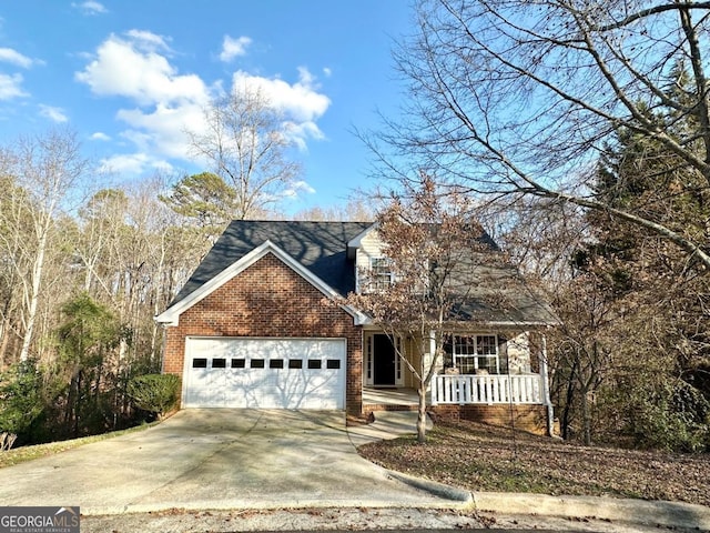 view of front of property featuring a porch and a garage