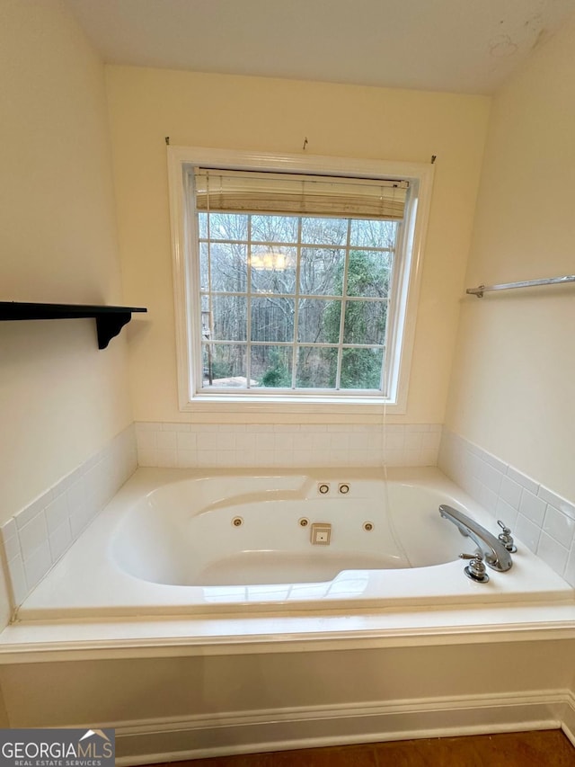 bathroom featuring a washtub