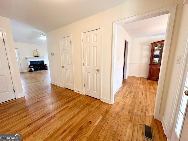 hallway with light hardwood / wood-style flooring