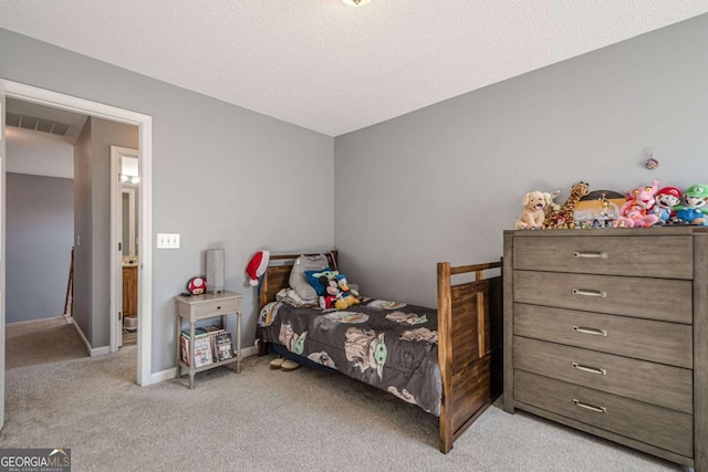 carpeted bedroom with a textured ceiling