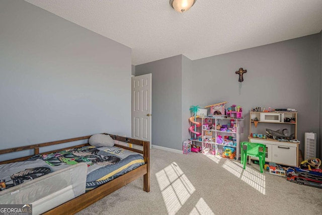 carpeted bedroom featuring a textured ceiling