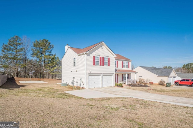 front facade with cooling unit, a garage, and a front lawn